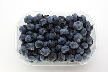 some sweet organic blueberries in a plastic container
