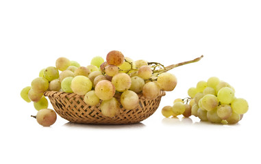 Juicy ripe clusters of grapes in a wattled basket