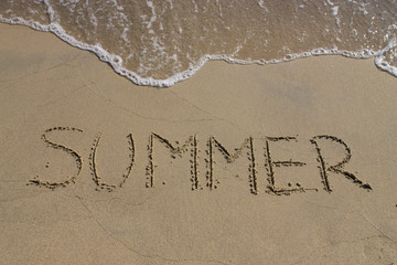 Word summer in beach