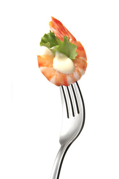 prawns and mayonnaise in a fork