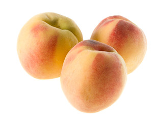 three ripe peaches isolated