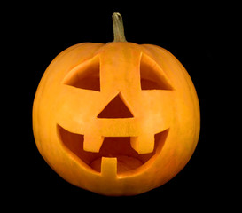 Halloween pumpkin face closeup isolated on black background