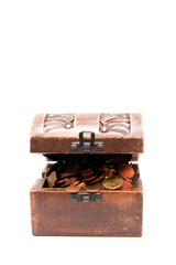A wooden ancient chest full of money..