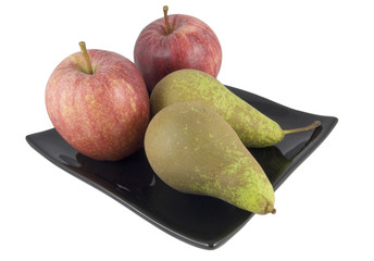 two apple and pears on black plate isolated on white