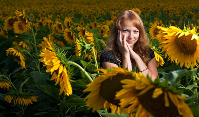 Smiling  woman in sunflower field