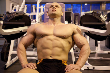 Fototapeta na wymiar bodybuilder rests in training room