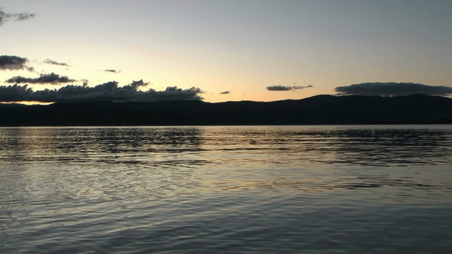 Sunrise on Baikal lake. Chivirkuy Bay. The Holy Nose Peninsula.