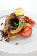carp fillet on organic potato and lemon