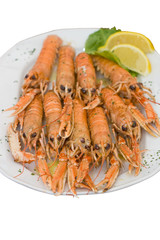 Big plate of cooked langouste facing the camera. Close view.