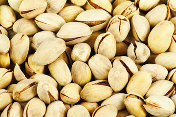Background texture of pistachios. Closeup shot.