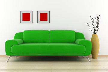 green sofa and vase with dry wood in front of white wall