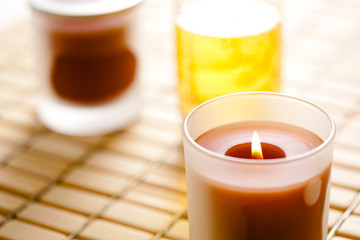 burning candle and massage oil