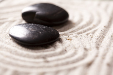 Fototapeta na wymiar hot stones in sand