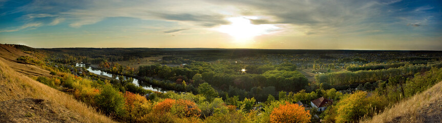 Fototapeta na wymiar Evening forest village panorama