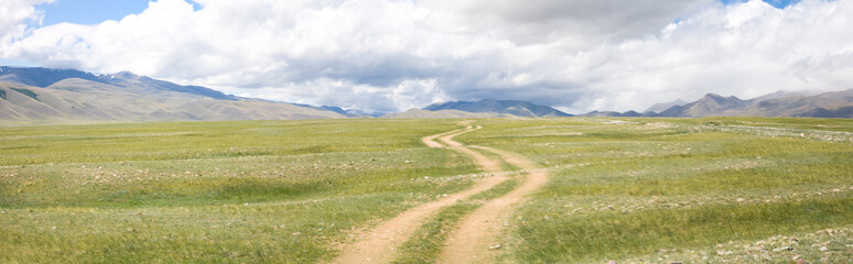 Fototapeta premium Road in the mountain steppes