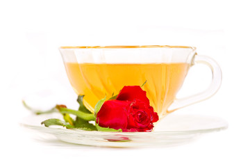 Tea in glass cup with red rose. (Low DOF)