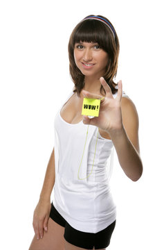 A girl in a white shirt with a plastic card. Text cards Wow