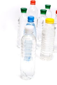 Plastic bottles of mineral water isolated on white background