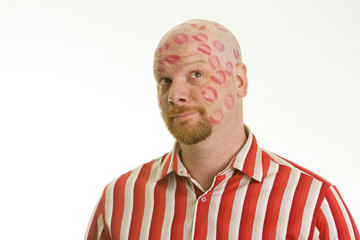 man covered in kisses