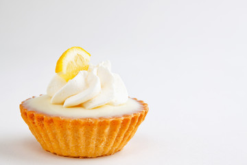 Rich creamy miniature lemon tart - shallow DOF, not isolated - obrazy, fototapety, plakaty