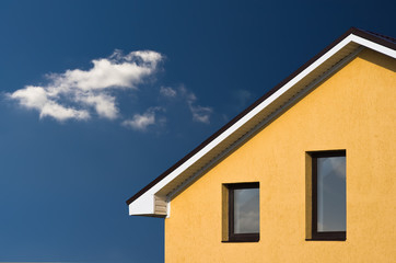 Fototapeta na wymiar abstract beautiful house facade under blue sky
