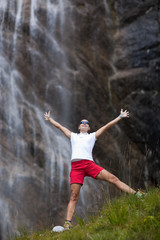 woman in front of waterfall