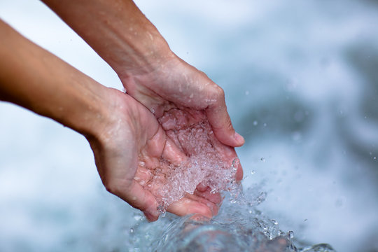 clear water in womans hands