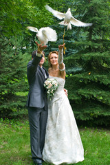 bride and groom with pigeons - 17350369