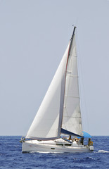 Fototapeta premium cruising sailboat speeding at open sea