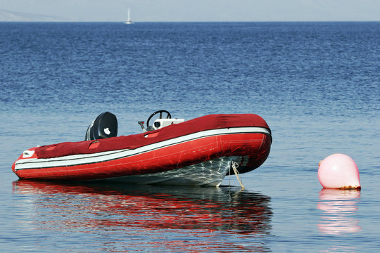 RIB, rigid inflatable boat moored at buoy