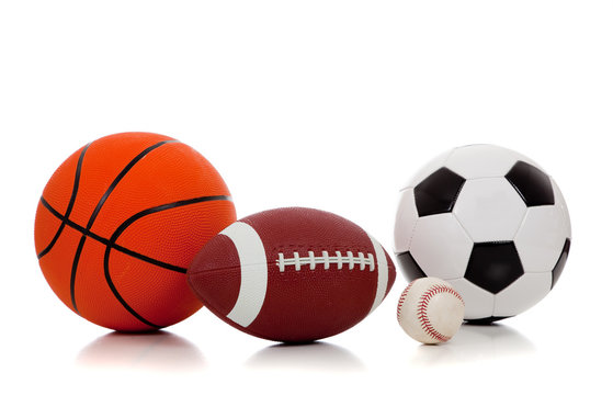 Assorted sports balls on white