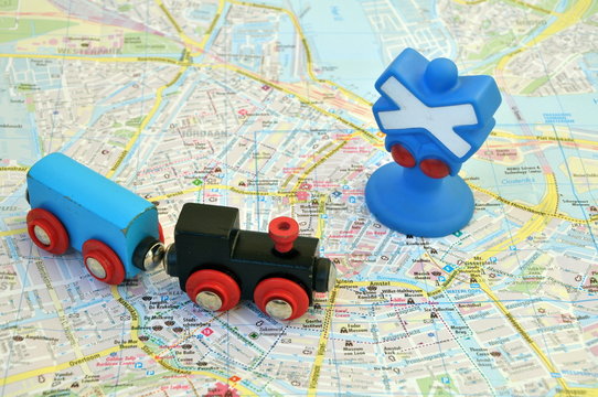 Toy train on the map of the city