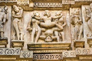 Kamasutra scene on the wall of a Temple in Khajuraho.