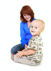smiling mother and son over white