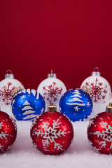 Christmas balls over a red background