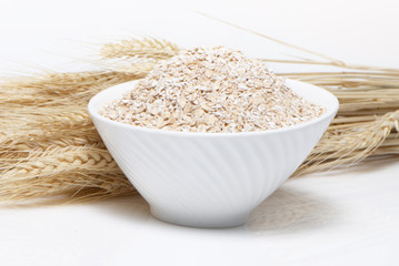 Porridge and Wheat ears on a white background