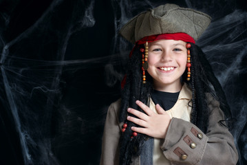 Little boy wearing pirate costume