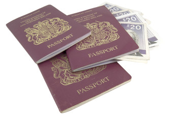three passports and money isolated on white background