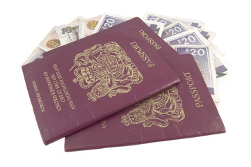 british passports and money isolated on white background
