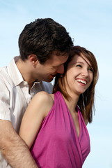 Fototapeta premium Young couple against the sky