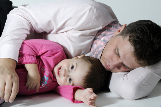 tired businessman with his daughter