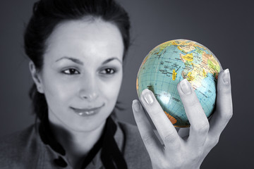 Globe in a girl's hands
