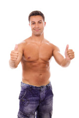 Fototapeta premium young atletic man tumb up, isolated on white