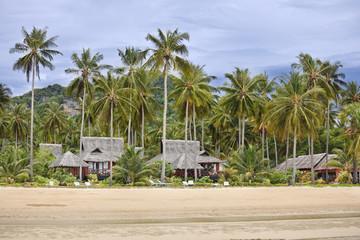 Bungalows on a tropical beach. © Stephane BENITO