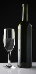 picture of wine glass and wine bottle isolated on black