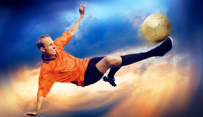 Naklejka premium Shoot of football player on the sky with clouds