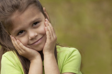 Preschool Girl with hands on Face.