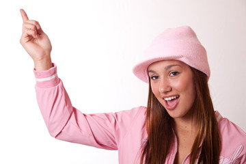 Young woman in pink outfit pointing