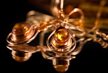 Earrings with precious amber