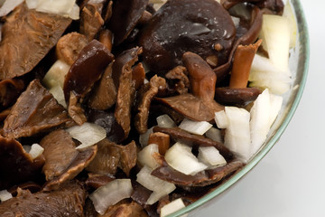 Salted mushrooms in glass dish